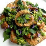 Stuffed horse mushroom served on seared puffball steaks with summer foliage
