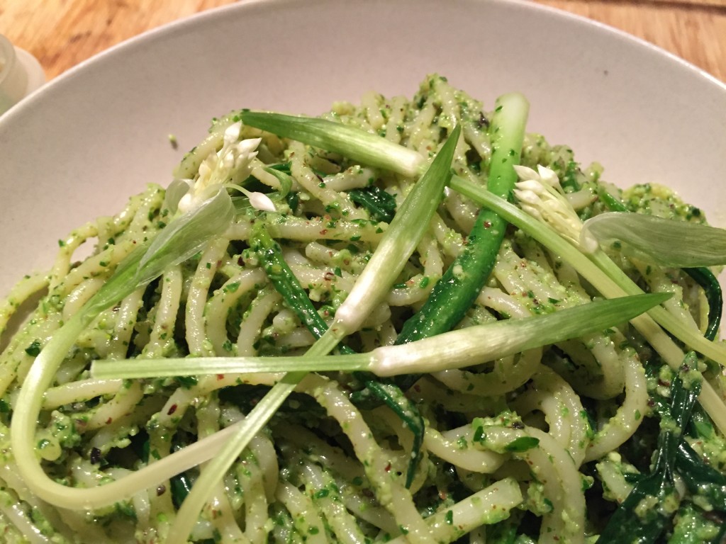 Spaghetti with wild garlic pesto and flower buds